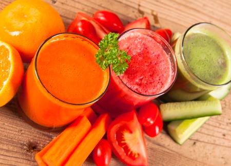 Fresh juice on wooden table の写真素材