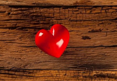 Valentines Day background with hearts on wooden tableの写真素材