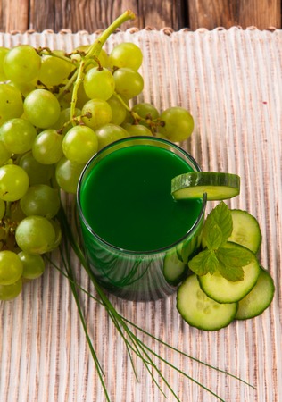 Healthy green cucumber, grape and lime juiceの写真素材