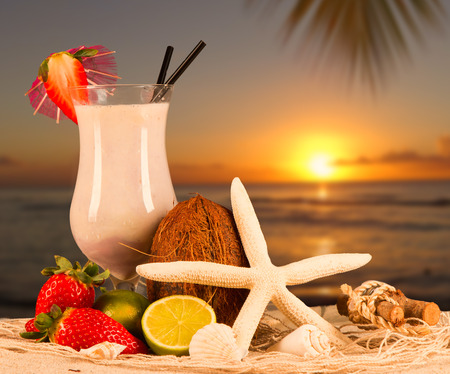 Fresh milk, strawberry drink on sand, assorted protein cocktail with fresh fruits and tropical beach の写真素材