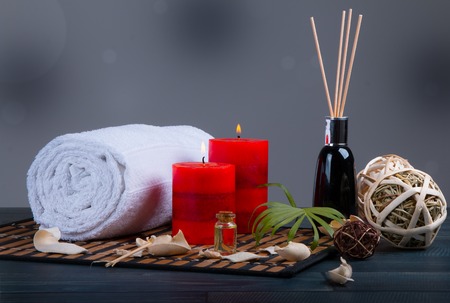 Spa still life, towel, aromatic candles with blur backgroundの写真素材