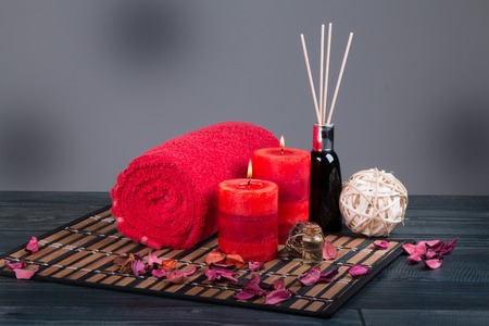 Spa still life, towel, aromatic candles with blur backgroundの写真素材