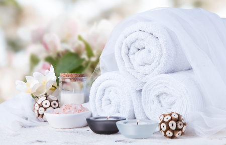 Spa concept still life with aromatic candles and flowerの写真素材