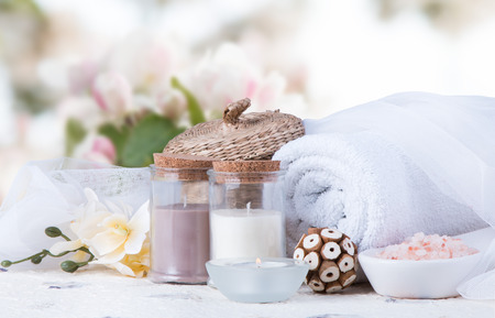 Spa concept still life with aromatic candles and flowerの写真素材