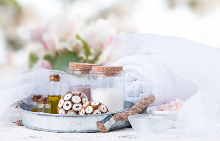 Spa concept still life with aromatic candles and flowerの写真素材