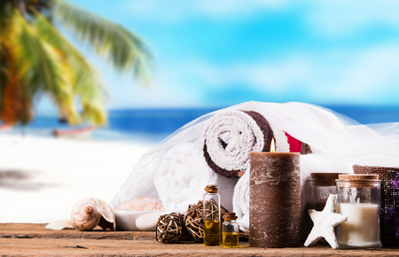 Spa massage setting with tropical beach backgroundの写真素材