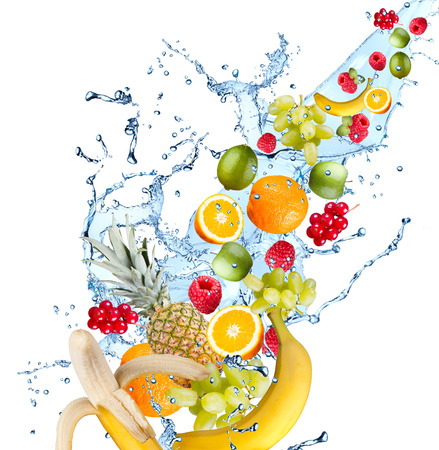 Fresh fruits falling in water splash, isolated on white backgroundの写真素材