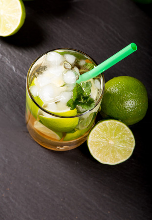 Mojito lime drink on black stoneの写真素材