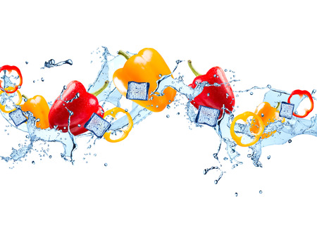 Water splash with vegetable isolated on white background. Fresh pepperの写真素材