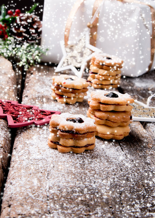 Christmas cookies, sweets on wooden table. Holiday roast. Celebration background.の写真素材