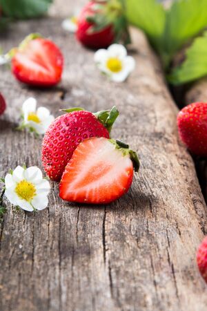 Fresh strawberry fruits on wooden tableの写真素材