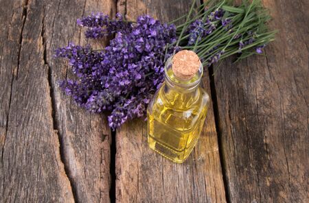 Spa massage setting, lavender product, oil on woodenの写真素材
