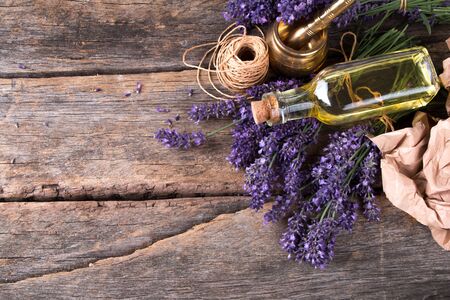 Spa massage setting, lavender product, oil on woodenの写真素材