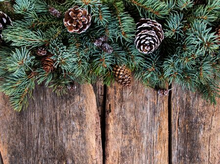 Christmas composition, Christmas decoration, ribbot, pine cone, pine on wooden table, Flat lay, copy space, free space for textの写真素材