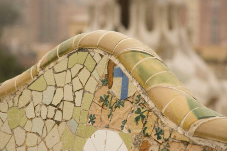 Detailed view of mosaic tile work with floral motifs. Artistic design, blurred background, and...