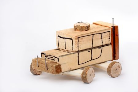 Handmade toy car from wooden blocks on white backgroundの写真素材