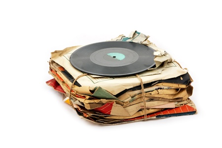 Pile of old vinyl plates isolated on white backgroundの写真素材