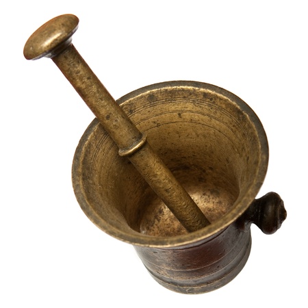 Old bronze mortar and pestle isolated on white backgroundの写真素材