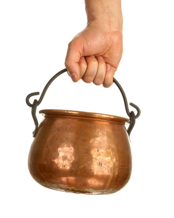 Male hand holding bronze pot isolated on whiteの写真素材