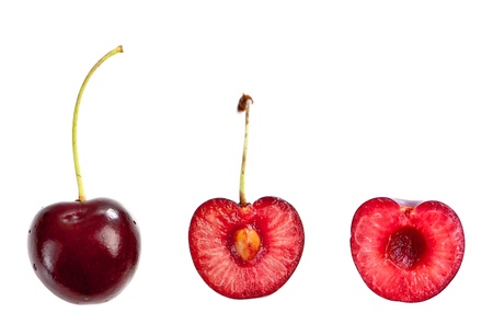 Whole and a half cut cherry isolated on white