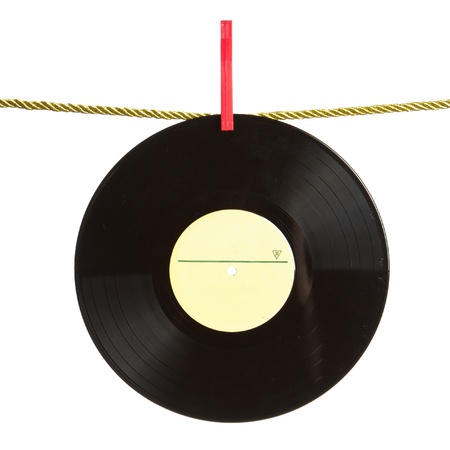 Vinyl record hanged by red clothes pin on gold rope isolated on white background