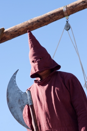 Hooded executioner of middle ages with axe