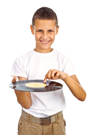 Boy in white shirt scratching vinyl record and smiling. Isolated on white backgroundの写真素材