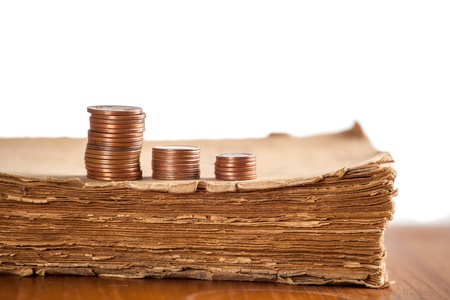 Copper coins on old softcover bookの写真素材