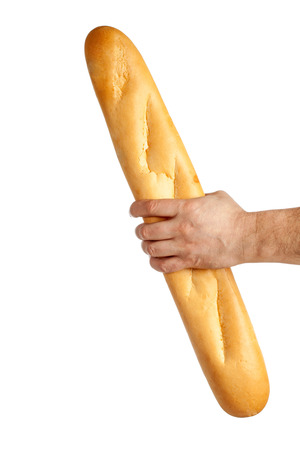 Hand holding french bread isolated over whiteの写真素材