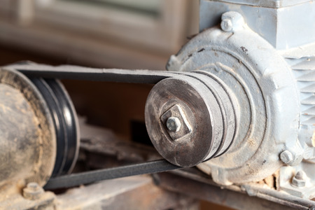 Gear wheels with belt driven by electric engine の写真素材