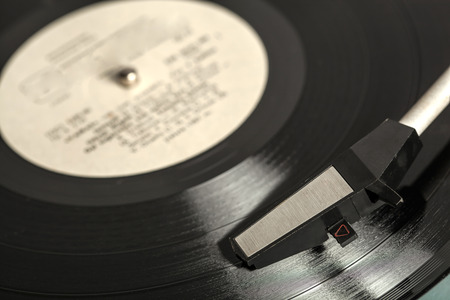 Old vinyl record spinning on turntable