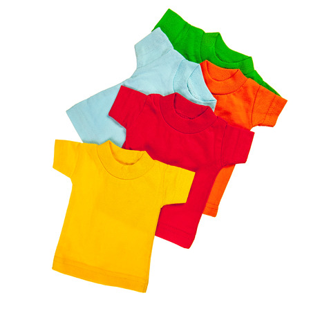 Green, orange blue, red and yellow t-shirts over white backgroundの写真素材