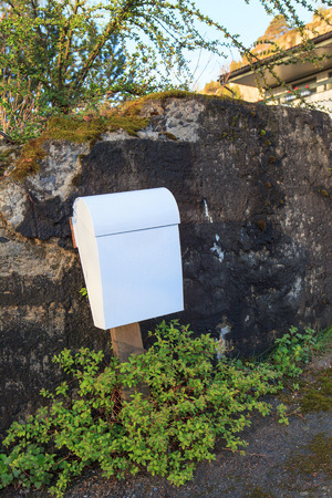White post box over rock backgroundの写真素材