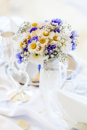 Bouquet of daisies on white tableの写真素材