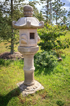 Japanese stone lantern in japan style gardenの写真素材