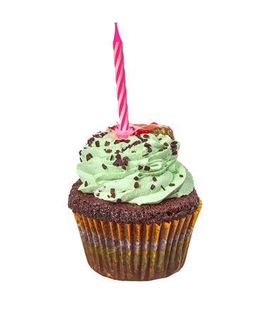 Green cupcake with red candle on top isolated on whiteの写真素材