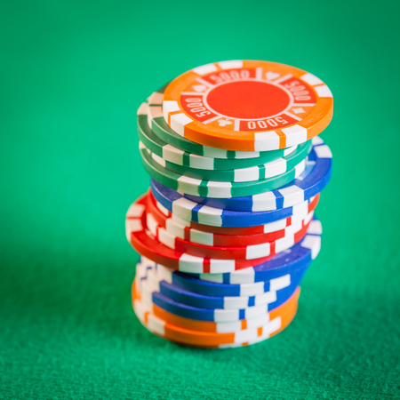 Poker chips on green backgroundの写真素材