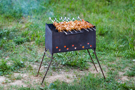 Shish kebab or Shashlyk on a barbecue grill over hot charcoal. の写真素材