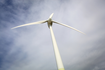 Windmill for electric power production over sky backgroundの写真素材