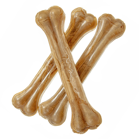 Three crossed dog bones isolated over whiteの写真素材