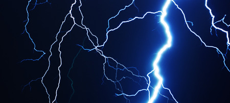 Strike of lightning in the night sky