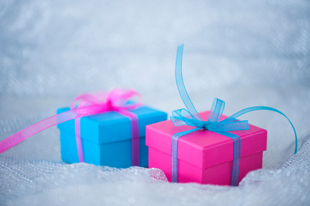 Gift boxes with ribbons on cloth backgroundの写真素材