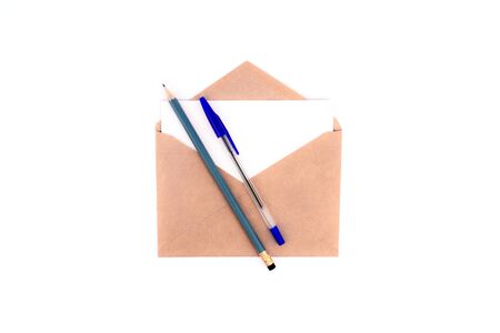 Craft envelope with letter white card, pen and pecil flat lay isolated on white background. top view with copy space. Communication, business concept. Web, social media banner. Stock photoの写真素材