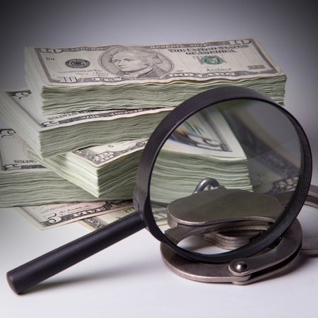 Finance and Law, economic crime, the punishment of the offender, pack of dollars, steel handcuffs, square image, DSLR photography, finance and law, shadow capital, punishment crime.の写真素材
