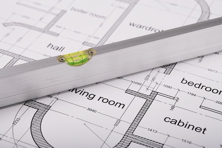 Bubble level, measuring tool, construction of the building layout, building drawing on paper,...