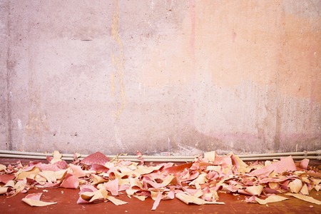 Carrying out repair work, the replacement of old paper wallpaper, renovation of residential apartments, heating system, construction debris, concrete wallの写真素材