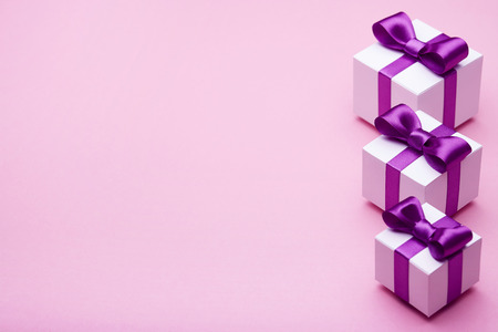 Gifts in a beautiful package, bow from satin ribbon, a few boxes with gifts, attributes festive...