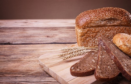 Fresh bread, sweet pastries, ears of ripe wheat, baked goods, harvest on the farm, lots of baked...