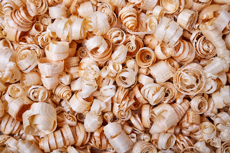 The texture of sawdust from wood, a natural building material, manual processing of woodの写真素材