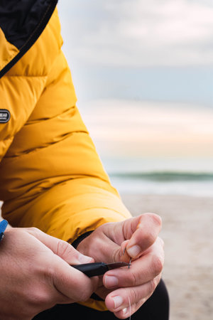 man fishing on the beach with sunriseの写真素材